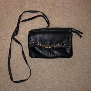 Black purse with gold accents